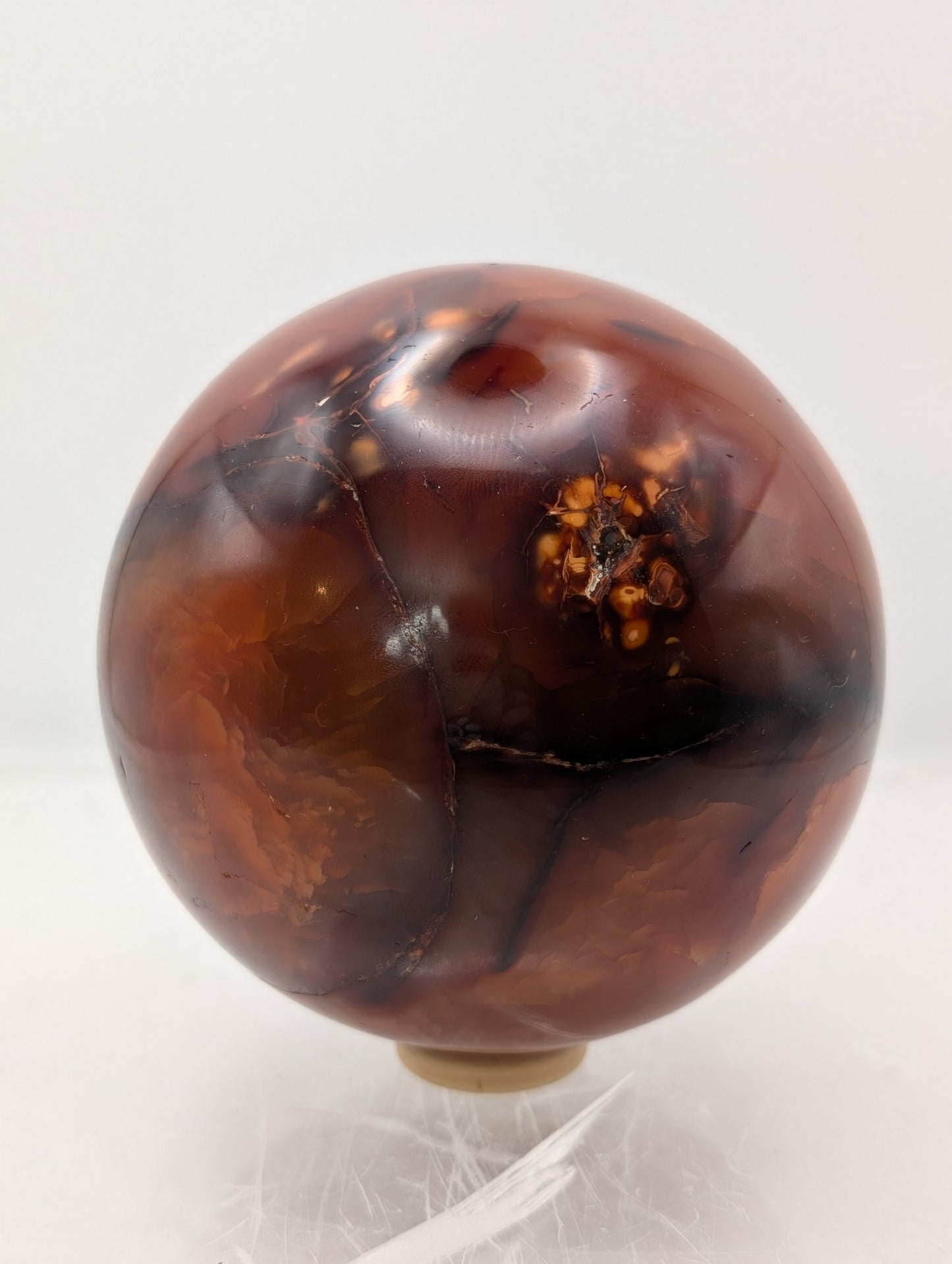 Large Carnelian Crystal Sphere with Wooden Ring Stand