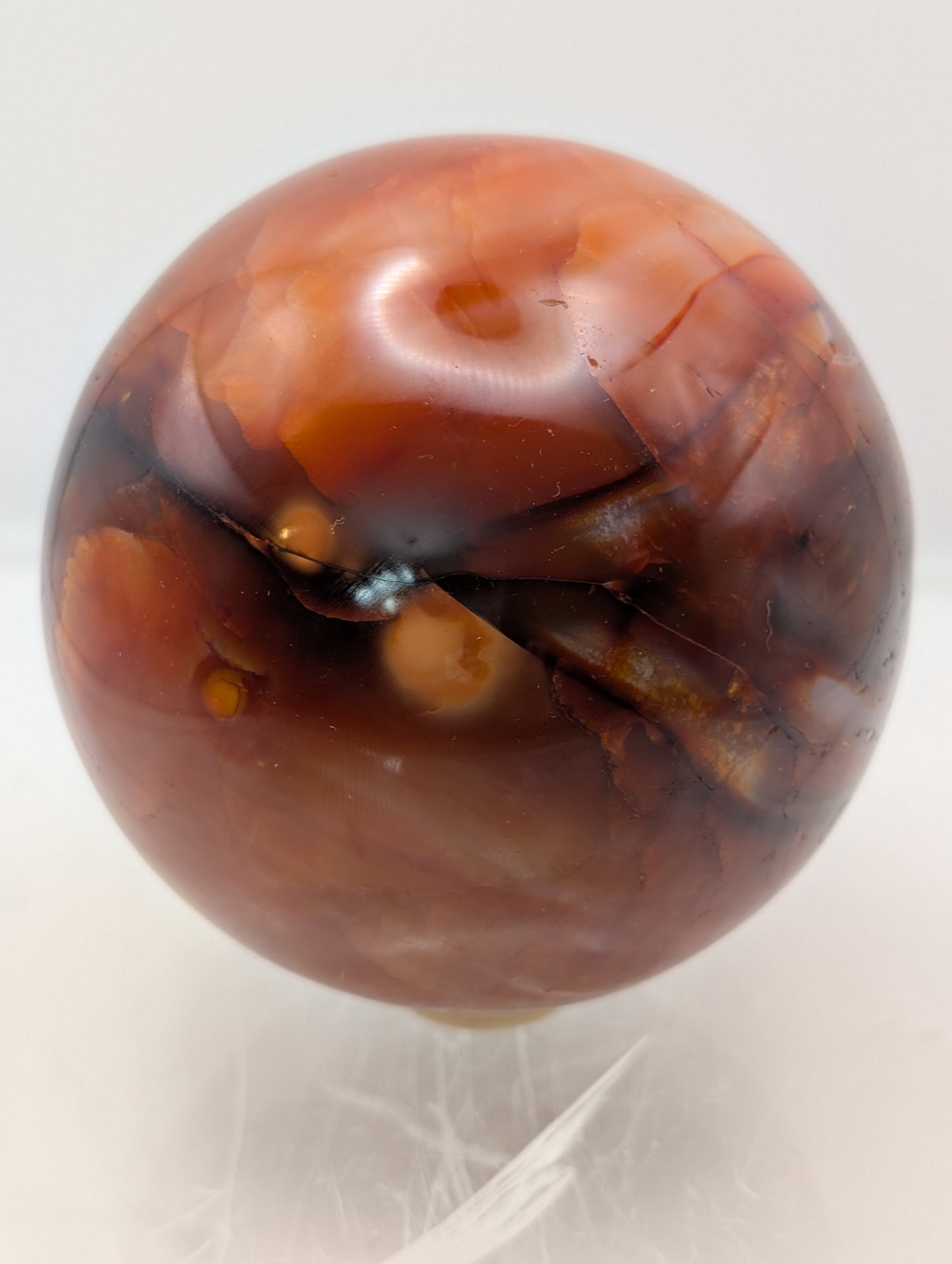Large Carnelian Crystal Sphere with Wooden Ring Stand