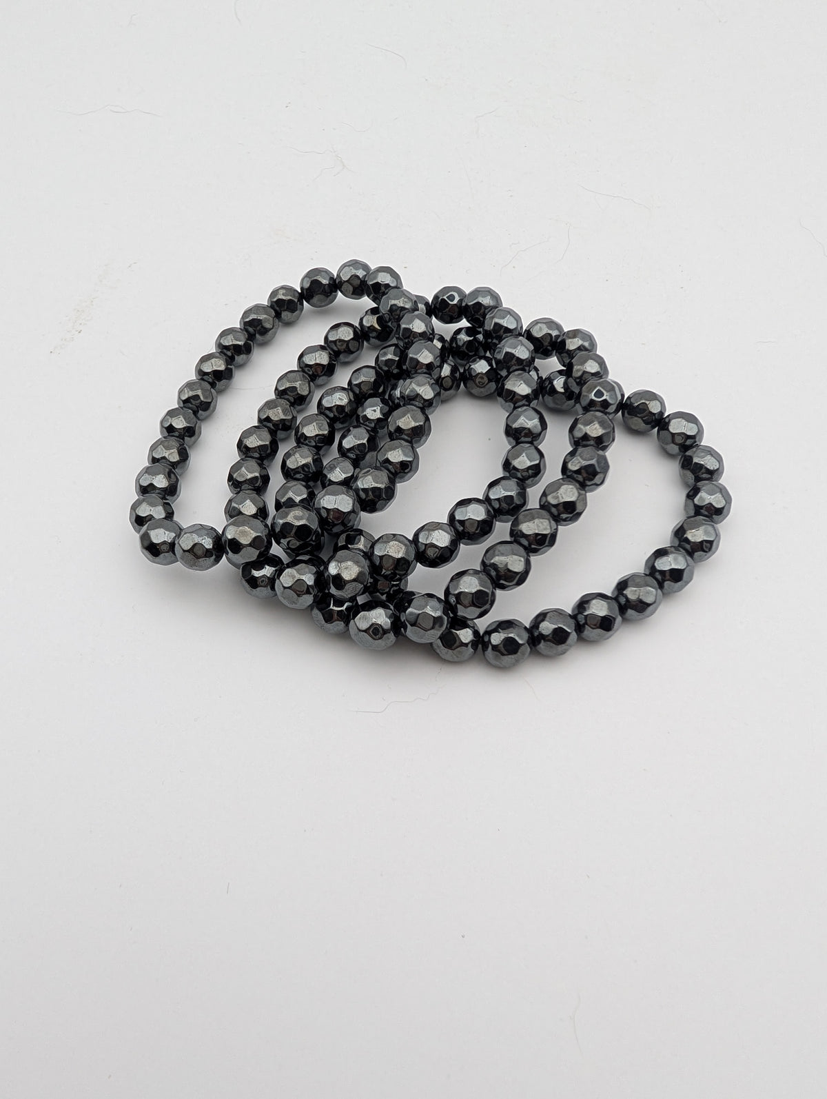Hematite beaded stretch bracelet with reflective faceted round beads
