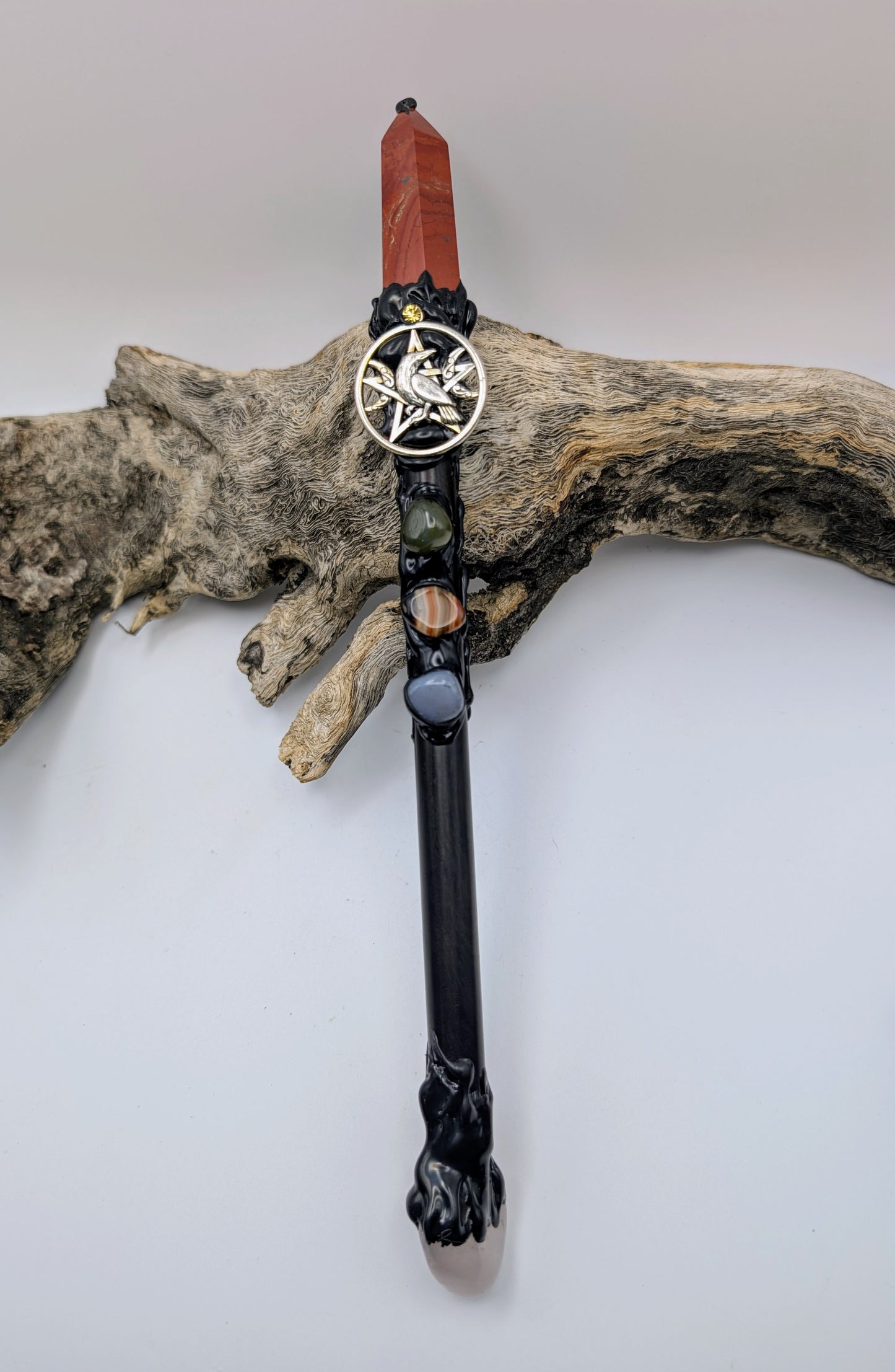 Red Jasper Point Crystal Magick Wand adorned with crystal tumble stones, rose quartz stone and silver pentagram with crescent moons and a raven