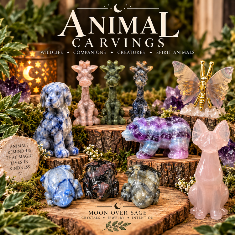 Moon Over Sage animal crystal carvings collection featuring gemstone dogs, giraffes, frogs, bear, cat and butterfly