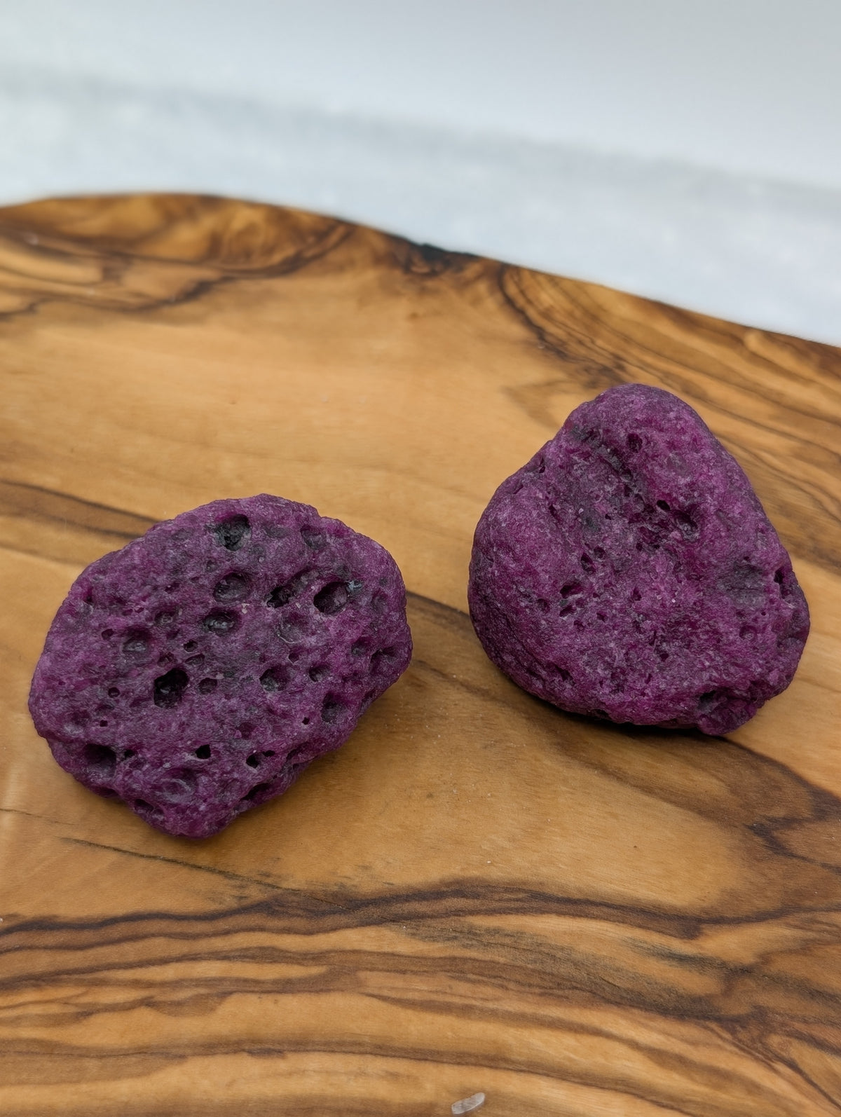 Honeycomb Ruby rough stones with porous raspberry pink and purple-red texture