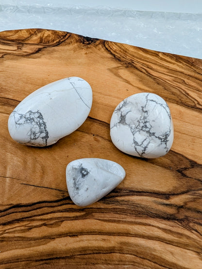 Polished Howlite tumble stones in multiple sizes with natural gray veining