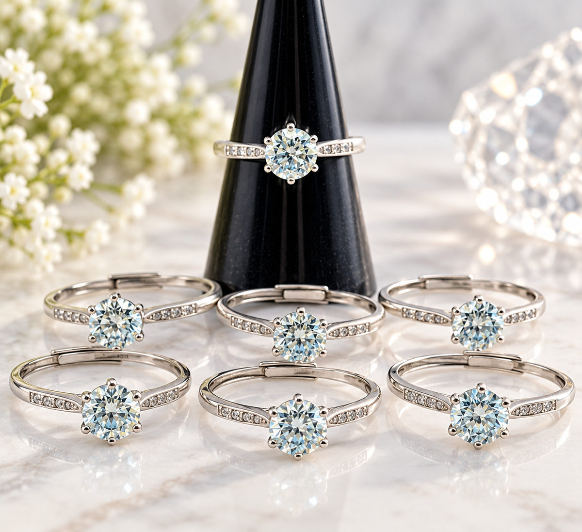 Mozambique Diamond sterling silver adjustable rings with round faceted stones displayed in boutique setting