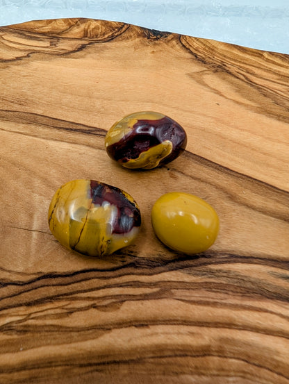 Polished Mookaite tumble stones with mustard yellow burgundy red and cream natural patterns