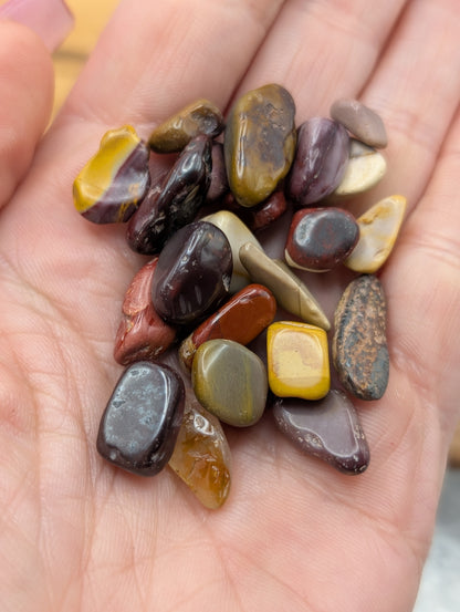Small polished Mookaite tumbles and chips in yellow red burgundy cream brown and mauve tones