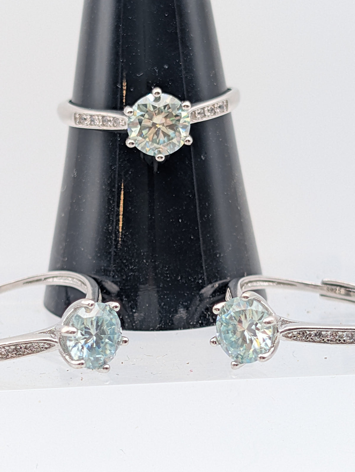 Mozambique Diamond adjustable sterling silver rings with round faceted center stones and accent bands