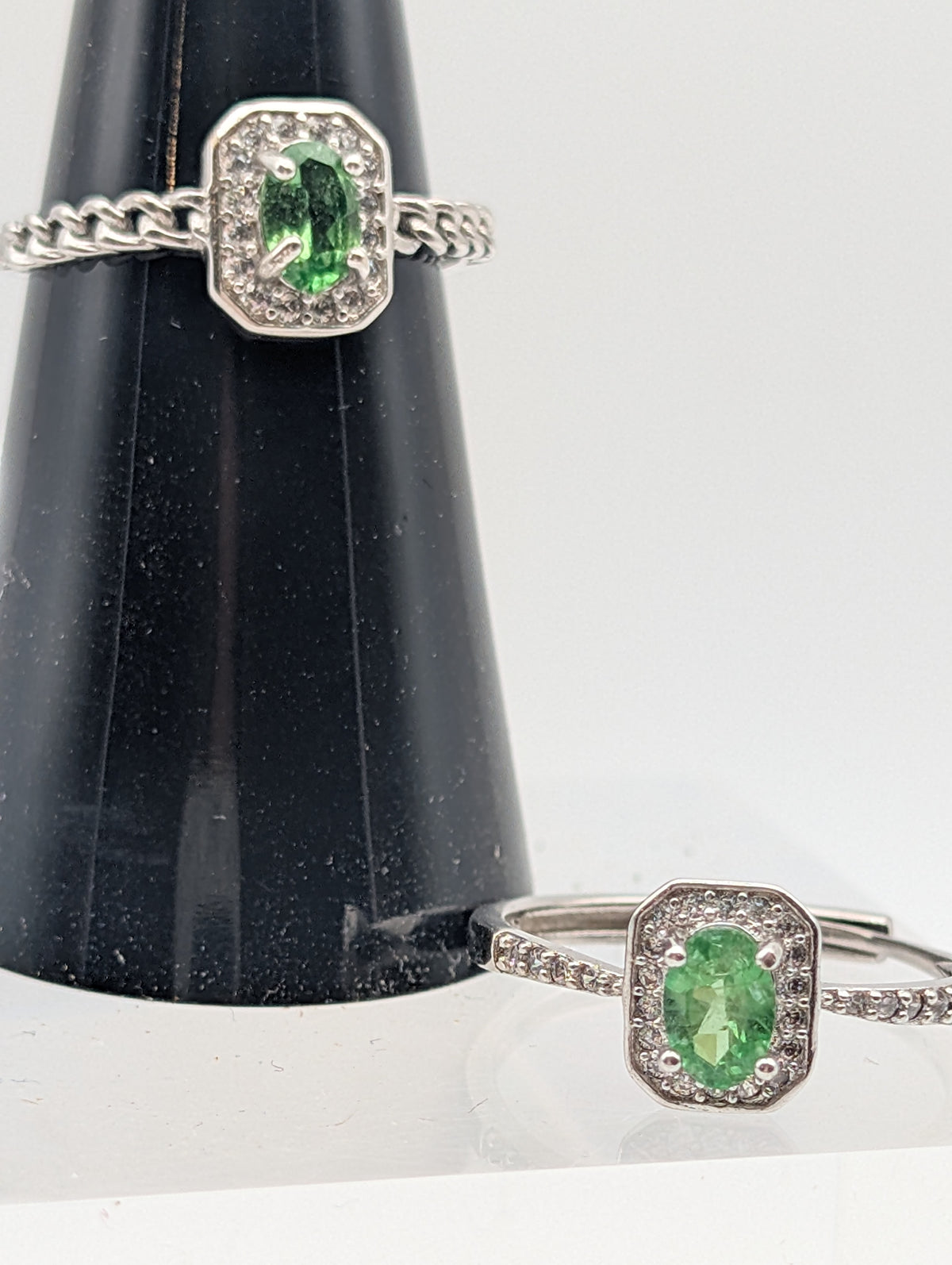 Dioptase sterling silver adjustable rings showing chain-link and pavé accent band styles