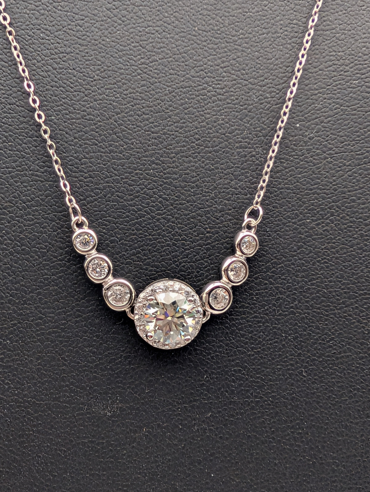 Mozambique Diamond sterling silver necklace with round faceted center stone and clear accent stones