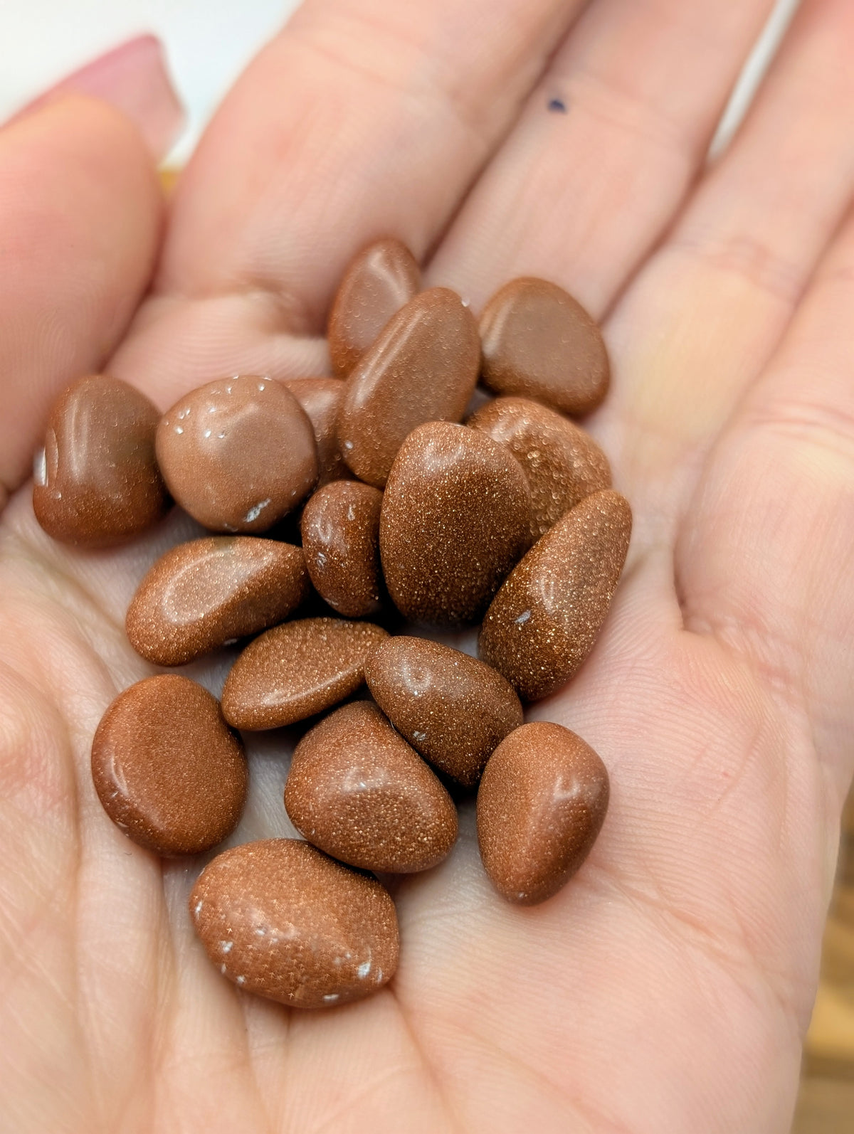 Red Sandstone small polished tumbles with coppery brown metallic sparkle