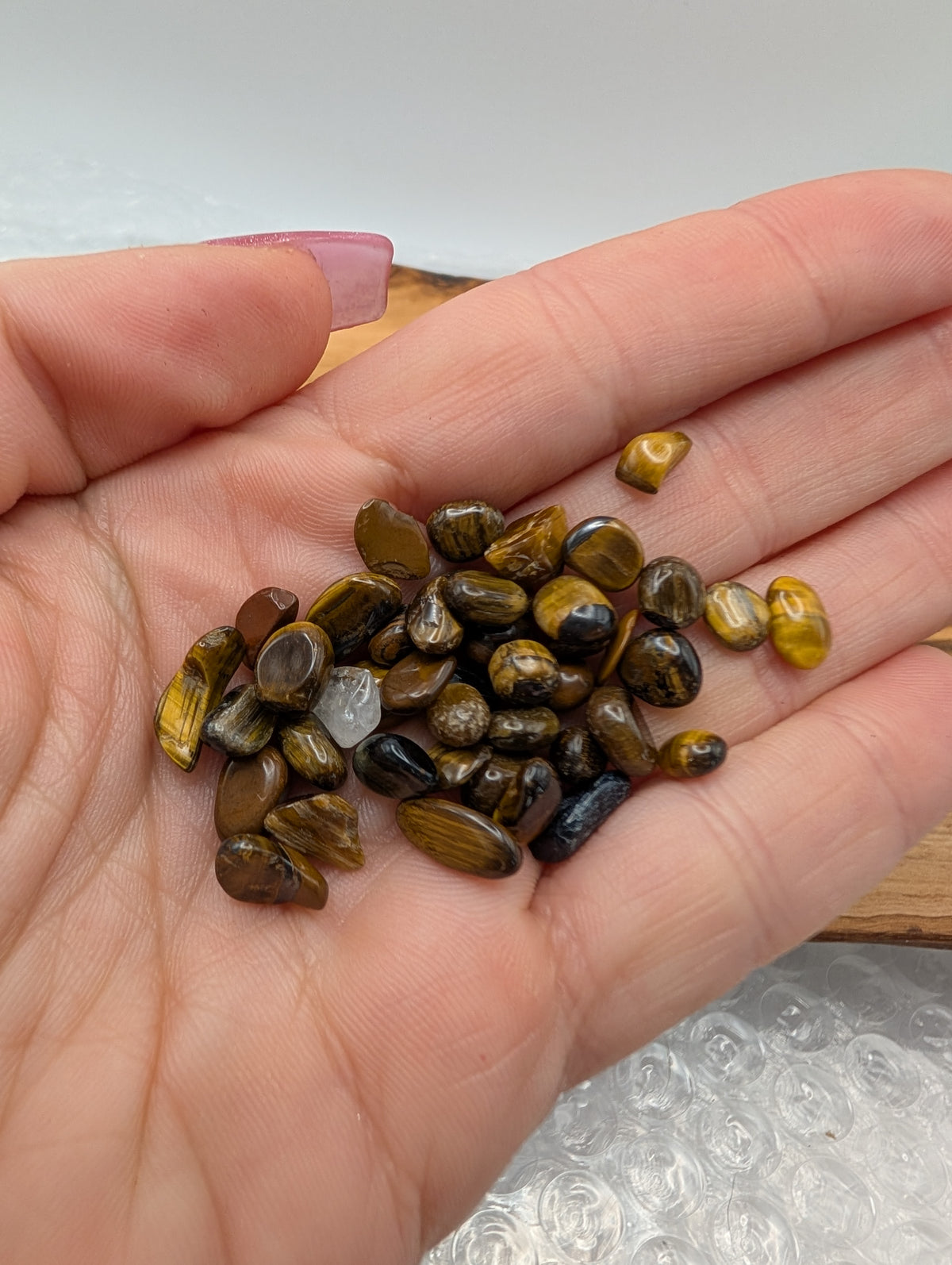 Polished Tiger's Eye crystal chips with golden brown and dark brown banding