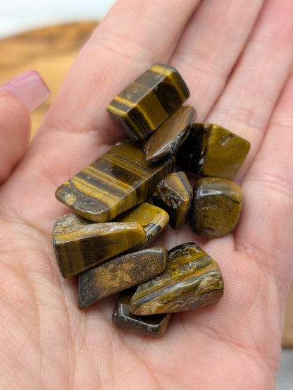 Small polished Tiger's Eye tumble stones with natural golden brown banding and chatoyancy