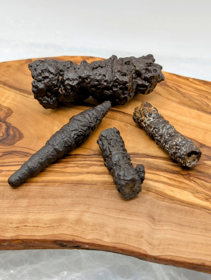 Raw Wishing Sticks with elongated dark brown rugged natural mineral formations