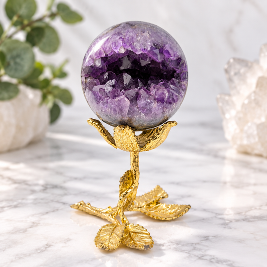 68mm Amethyst open smile geode sphere with purple crystal points displayed on decorative gold-tone stand