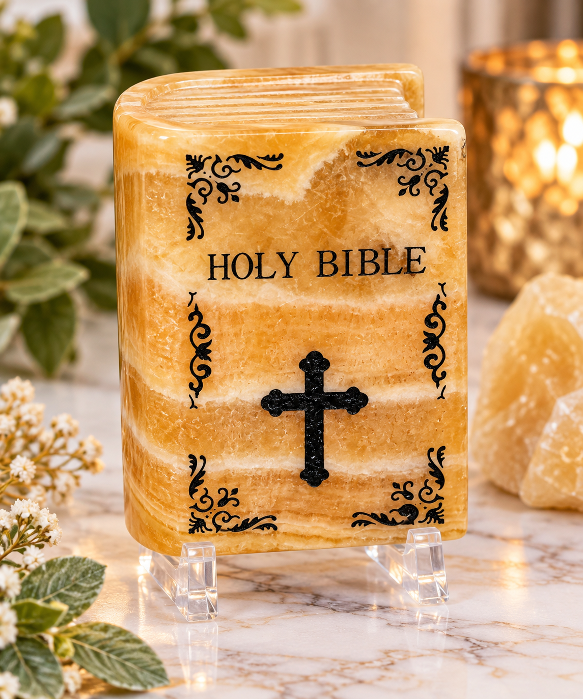 Honey Calcite crystal Holy Bible carving with natural golden banding and black decorative detailing on display stand