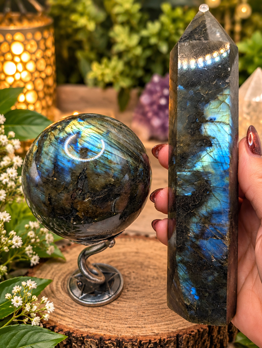 Labradorite sphere and tower showing vivid blue and teal flash with silver snake sphere stand